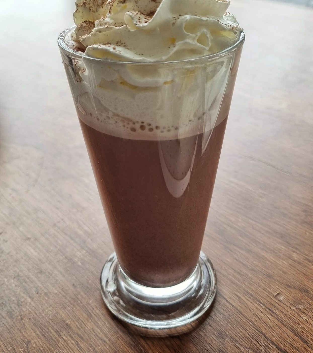A hot chocolate topped with whipped cream
